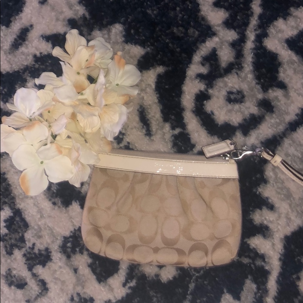 Cream and white coach wristlet